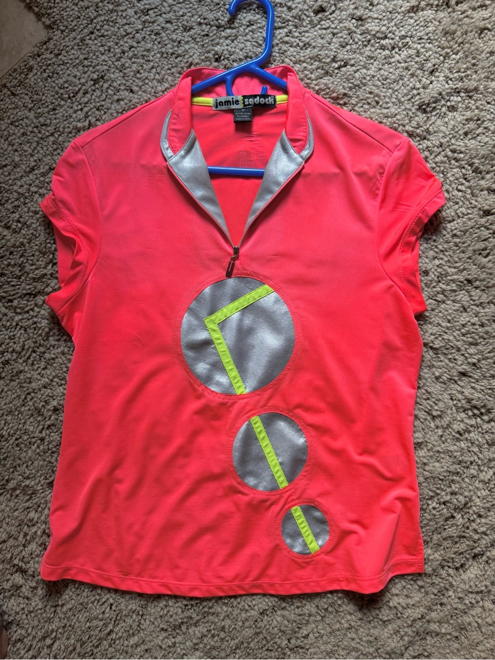 jamie sadock neon coral polo with silver & lime accents